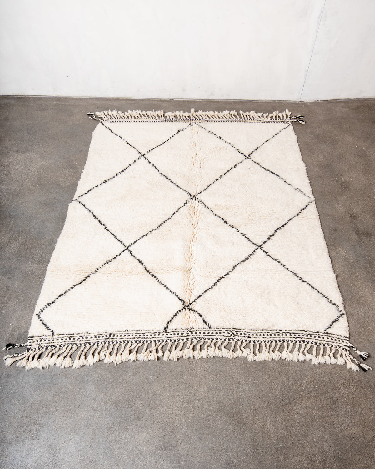 Modern, designer, handcrafted Berber rug from Morocco. Beniourain carpet with minimalist design, natural wool pile and a fluffy texture.